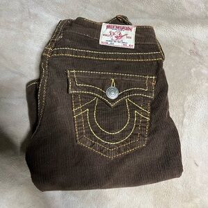True religion jeans, size 27, brown and yellow and orange on the stitches